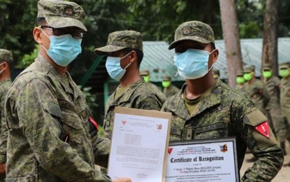 <p><strong>HONORED.</strong> Lt. Col. Jo-ar Herrera, commander of the 53rd Infantry Battalion, poses with one of the soldier-awardees during a ceremony honoring a squad of the battalion's Bravo Company on Friday (July 17, 2020) for their "heroic achievement" in the fight against the communist New People's Army in Zamboanga del Norte. The soldiers managed to recover high-powered firearms and an improvised explosive device during a firefight with communist guerillas in Siayan town, Zamboanga del Norte on July 11, 2020. <em>(Photo courtesy of 53IB)</em></p>