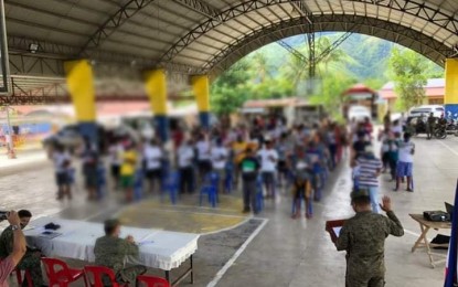 <p><strong>LOYALTY TO GOV'T</strong>. At least 63 supporters of the Communist Party of the Philippines-New People's Army (CPP-NPA) vow loyalty to the government in a ceremony held in Barangay Maligaya, Gabaldon, Nueva Ecija on Friday (July 17, 2020). Those who renounced support to the communist terrorist group were 42 members of Alyansya ng mga Magbubukid na Nagkakaisa (Almana), one member of Milisyang Bayan, and 20 members of the Komiteng Larangang Guerilla (KLG) Sierra Madre. <em>(Photo courtesy of the Army's 91st Infantry Battalion)</em></p>
