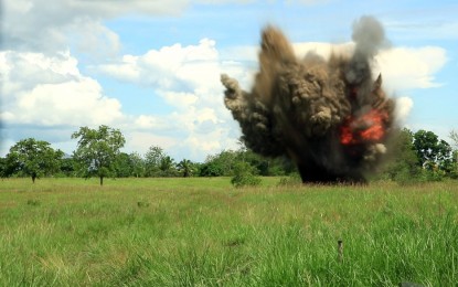 <p><strong>EXTREMELY LETHAL.</strong> Combined explosive and ordnance (EOD) teams from the 23rd IB and the Philippine National Police Mobile Force Battalion 13 dispose of eight anti-personnel mines and 254 packs of ammonium nitrate on July 17, 2020. The disposal activity was held in a vacant land in Purok 6, Barangay Alubihid, Buenavista, Agusan del Norte.<em> (Photo courtesy of 23IB)</em></p>