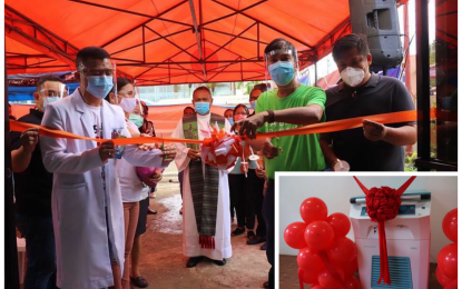 <p><strong>COVID-19 TREATMENT CENTER.</strong> Kidapawan Mayor Joseph Evangelista (in green shirt) cuts the ribbon for the launching on Monday (July 20, 2020) of their PHP4.3–million temporary treatment and monitoring facility for locally stranded individuals and overseas Filipino workers from the city. Also on Monday, the mayor inaugurated the newly acquired PHP5-million refrigerated centrifuge equipment (inset) that would be used for the separation of blood components, such as platelets and red blood cells, required for dengue patients at the city blood center. <em>(Photos courtesy of Kidapawan CIO)</em></p>