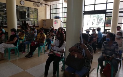 <p><strong>LIVELIHOOD AID.</strong> A total of 27 overseas Filipino workers (OFWs) wait to receive their livelihood assistance at the Antique capitol lobby on Tuesday, July 21, 2020. The Antique provincial government grants PHP10,000 to each OFW who opts to stay in the province to help them provide for their family by starting their own business<em>. (PNA photo by Annabel Consuelo J. Petinglay)</em></p>