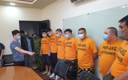 <p><strong>KIDNAPPERS NABBED.</strong> Kidnap victim Le Chen (left) identifies his kidnappers before authorities at the PNP-Anti Kidnapping Group office in Camp Crame on Tuesday (July 28, 2020). Six Chinese nationals and their Filipino accomplice were arrested in the operation. <em>(Photo courtesy of PNP-AKG)</em></p>