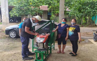 <p><strong>EQUIPMENT SUPPORT.</strong> Members of the Rural Improvement Club in Barangay San Mateo, Butuan City, inspect the newly delivered cassava chipper they received from the Department of Agriculture 13 (Caraga region) last week. Eight associations of cassava farmers in Butuan City and Las Nieves in Agusan del Norte have received PHP2 million worth of assorted post-harvest equipment from DA-13. <em>(Photo courtesy of DA-13 Information Office)</em></p>
