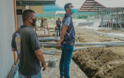<p><strong>COVID-19 FACILITY</strong>. Mayor Renato Gustilo (right) of San Carlos City, Negros Occidental visits the construction site of the city’s temporary coronavirus disease 2019 (Covid-19) facility in Barangay Rizal on Monday (July 27, 2020). The PHP10-million project has two isolation building and four buildings for persons under investigation. <em>(Photo courtesy of San Carlos City Information Office)</em></p>