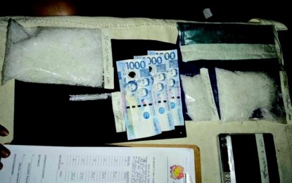 <p><strong>BUSTED</strong>. A 'high-value' suspected drug pusher was arrested during a joint buy-bust operation in Barangay Cadawinon, Dumaguete City on Tuesday night (July 28, 2020). Seized from him were some 500 grams of suspected shabu with an estimated Dangerous Drugs Board value of P3.4 million, and three P1,000 bills (shown in photo) used in the buy-bust. <em>(Photo by Juancho Gallarde)</em></p>