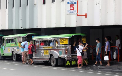 <p><strong>MORE JEEPNEYS.</strong> Passengers wait to board a traditional public utility jeepney (TPUJ) in this undated photo. The Land Transportation Franchising and Regulatory Board (LTFRB) on Tuesday (Nov. 10, 2020) announces the opening of 16 more routes for 816 traditional jeepneys. <em>(PNA File Photo)</em></p>