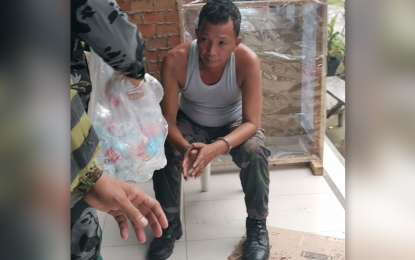 <p><strong>NABBED FOR EXTORTION.</strong> Staff Sgt. Roberto Galvez Francisco is arrested in an entrapment operation in Barangay Labuan, Zamboanga City on Friday (July 31, 2020). The entrapment was launched following complaints from motorists that he was extorting money from them. <em>(Photo courtesy of Police Regional Office 9 Public Information Office)</em></p>