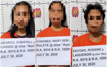 <p><strong>APPREHENDED</strong>. The three suspected leaders of the Communist Party of the Philippines - New People’s Army (CPP-NPA) arrested by military and police troops in Sitio Victory, Barangay Minapasuk in Calatrava, Negros Occidental on Thursday afternoon (July 30, 2020). Considered as ranking officials of the Komiteng Rehiyon - Negros/Cebu/Bohol/Siquijor, Christell Abordo, Mary Dem Forones, and Rossine Enyong are in the custody of the Calatrava municipal police. <em>(Photo courtesy of the 79th Infantry Battalion, Philippine Army)</em></p>
