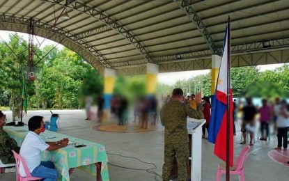 <p><strong>PLEDGE OF ALLEGIANCE</strong>. Thirty-two former supporters of the Communist Party of the Philippines - New People's Army in Nueva Ecija vow loyalty to the government in a ceremony held in Barangay Malinao, Gabaldon on Friday (July 31, 2020). Those who renounced support for the communist terrorist group were 12 members of the Alyansang Magbubukid na Nagkakaisa, which is categorized as an underground mass organization, and 20 Exploited Local Populace (supporters/contacts/couriers) in Barangay Malinao, coerced to support the communist group operating in Nueva Ecija. <em>(Photo by Jason de Asis)</em></p>