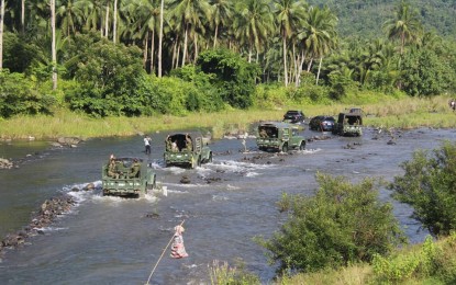 <p><strong>CLEARED OF REBELS</strong>. Military trucks cross a river en route to a convergence activity in a remote village in Abuyog, Leyte in this July 3, 2020 photo. Government troops said on Monday (Aug. 3, 2020) the New People’s Army is having a hard time to recover their former strongholds in Leyte after the dismantling of two guerrilla fronts in the province early this year.<em> (Photo courtesy of Philippine Army’s 14th Infantry Battalion )</em></p>