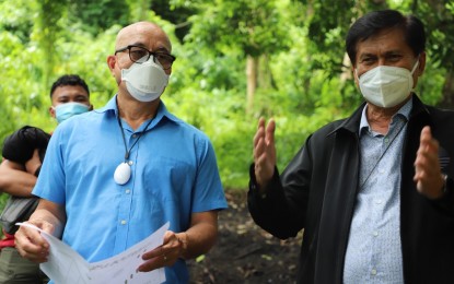 <p><strong>NO CUTTING OF TREES.</strong> Environment Secretary and Cebu Covid-19 response overseer Roy Cimatu concurs with IATF-EID deputy chief implementer Melquiades Feliciano as they visit the proposed grave site for deceased coronavirus patients on July 20. Cimatu on Tuesday (Aug. 4, 2020) ordered the regional office of the Department of Environment and Natural Resources to ensure that no trees will be cut in Sitios Baksan and Patay'ng Yuta in upland Barangay Sapangdaku and to make the proposed cemetery project environmentally sound. <em>(Photo courtesy of IATF)</em></p>