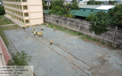 <p><strong>MORE QUARANTINE FACILITIES.</strong> Workers from the Department of Public Works and Highways conduct site development works for a quarantine facility to be built at the Arkong Bato National High School in Valenzuela City on Tuesday (Aug. 4, 2020). The DPWH eyes to build 23 more quarantine facilities in Metro Manila in response to the coronavirus disease 2019 health crisis.<em> (Photo from DPWH Secretary Mark Villar's Facebook page)</em></p>