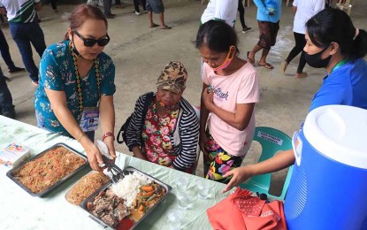 <p><strong>SERVICE CARAVAN.</strong> Dinagat Islands Governor Arlene 'Kaka' Bag-ao (left) leads the People’s Day Caravan 2020 in the town of Libjo on Monday (Aug. 10, 2020), which benefited some 3,000 residents. The locals received goods, as well as various services from the provincial government. <em>(Photo grab from Province of Dinagat Islands Information Office Facebook Page)</em></p>