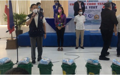 <p>Health Secretary Francisco Duque III (left) during the ceremonial distribution of face masks to the residents of Antipolo City on Wednesday (Aug. 12, 2020).  (<em>PNA photo by: Ma. Teresa Montemayor</em>)</p>