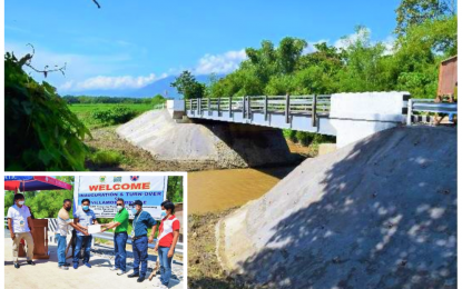 <p><strong>BRIDGE FOR FARMERS.</strong> The PHP7.9-million concrete bridge is expected to bring relief to farmers and agrarian reform beneficiaries in Esperanza, Sultan Kudarat. The project was turned over on Wednesday (Aug. 12, 2020) to a local farmers’ association (inset), witnessed by town officials. <em>(Photo courtesy of DAR-SK)</em></p>