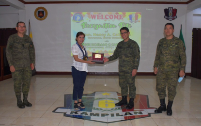<p><strong>RECOGNIZED.</strong> North Cotabato Governor Nancy Catamco receives a plaque of recognition from the Army’s 6th Infantry Division commander, Maj. Gen. Diosdado Carreon, during a ceremony held at Camp Siongco, Datu Odin Sinsuat, Maguindanao on Thursday (Aug. 13, 2020). Catamco and other governors in Central Mindanao were recognized for their support for the campaign against criminality and terrorism, as well as peace and development programs in the region.<em> (Photo courtesy of 6ID)</em></p>