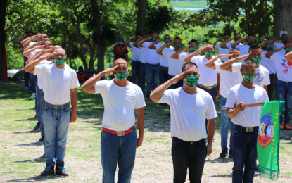 <p><strong>LOYALTY TO PHILIPPINE FLAG.</strong> Some 122 men salute the Philippine flag during their unit’s formal activation at the para-military training camp of the Army’s 6th Infantry Division in Datu Odin Sinsuat, Maguindanao on Friday (Aug. 14, 2020). They will train to become government militiamen as part of the augmentation of security personnel for Tacurong City in Sultan Kudarat province. <em>(Photo courtesy of Tacurong LGU)</em></p>
