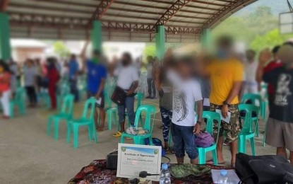 <p><strong>OATH OF ALLEGIANCE</strong>. A total of 82 former members and supporters of the CPP-NPA-NDF take their oath of allegiance to the government in a ceremony held in Barangay Cozo, Casiguran, Aurora on Saturday (Aug. 15, 2020). Out of the total figure, six are former CPP-NPA members while 76 were members of the Bataris group<em>. (Photo courtesy of the Army's 91st Infantry Battalion)</em></p>
