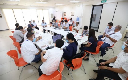 <p><strong>NO MORE BAN</strong>. Iloilo City Mayor Jerry P. Treñas ( right, end of table) meets with the Covid Team on Monday (Aug. 17, 2020). He immediately convened the team to prepare for the arrival of locally-stranded individuals and returning overseas Filipinos as the city will no longer extend the moratorium against their arrival. <em>(Photo by Arnold Almacen/CMO)</em></p>