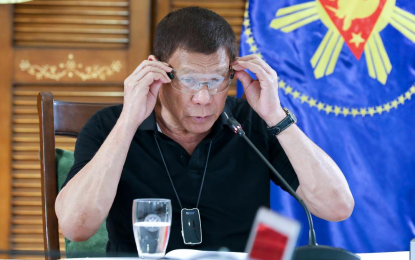 <p><strong>LIVELY.</strong> President Rodrigo Roa Duterte puts on protective eyewear as he talks to the people after holding a meeting with the Inter-Agency Task Force on the Emerging Infectious Diseases (IATF-EID) core members at the Matina Enclaves, Davao City on Monday (August 17, 2020). Malacañang on Tuesday (Aug. 18) said Duterte seems to be “lively” and remains to be in very good condition. <em>(Presidential photo by Robinson Niñal Jr.)</em></p>