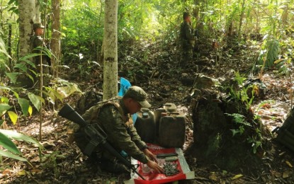 <p><strong>AMMOS, FOOD SUPPLIES SEIZED.</strong> Government troops recover various types of ammunition and food supplies in a hideout of the communist New People’s Army in the forested area of Barangay Tungao, Butuan City on Tuesday evening (Aug. 23, 2020). The discovery of the rebel hideout is attributed by the military to civilian tip-offs.<em> (Photo courtesy of 23IB)</em></p>