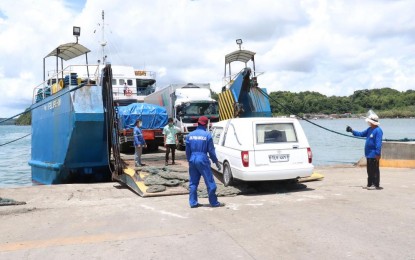 <p><strong>HOME AT LAST</strong>. The funeral car carrying the remains of Milagros Sumaculob, an OFW who died in an explosion in Beirut, Lebanon, boards the roll-on, roll-off vessel bound for Guimaras on Tuesday (Aug. 18, 2020). The Guimaras OFW was supposed to go home for good this December 2020.<em> (Photo courtesy of Public Information and Relations Guimaras)</em></p>