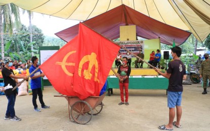 <p><strong>END OF SUPPORT.</strong> Flags of the Communist Party of the Philippines-New People’s Army (CPP-NPA) are burned during the mass surrender of 150 members and supporters of the rebel movement in Carmen, Agusan del Norte, on Thursday (Aug. 20, 2020). Similar mass surrender ceremonies were also held in the provinces of Agusan del Sur and Surigao del Sur recently. <em>(Photo courtesy of 23IB)</em></p>