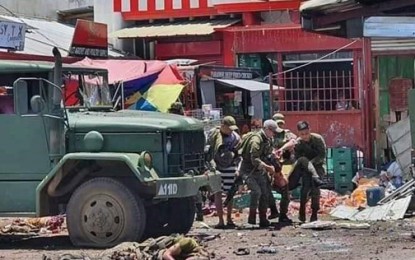 <p><strong>JOLO BLASTS.</strong> Nine people, including four soldiers, are killed in two successive bomb explosions in Jolo, Sulu. Soldiers carry one of the casualties in the first bomb explosion around 11:53 a.m. Monday (Aug. 24, 2020) in front of an eatery in Barangay Walled City, Jolo, Sulu. The second explosion occurred around 1:06 p.m. <em>(Photo courtesy of 11th Infantry Division Explosive Ordnance Demolition)</em></p>