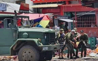 <p><strong>TWIN BLASTS.</strong> Soldiers evacuate one of the casualties in the first bomb explosion in front of an eatery in Barangay Walled City in Jolo, Sulu at about 11:53 a.m. on Monday (Aug. 24, 2020). Malacañang condemned the explosion incidents that killed 11 people, including six soldiers, and wounded 40 others. <em>(Photo courtesy of 11th Infantry Division Explosive Ordnance Demolition)</em></p>