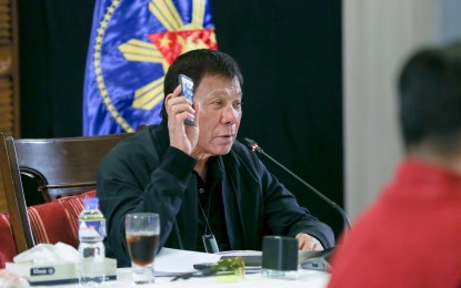 <p><strong>IN GOOD CONDITION</strong>. President Rodrigo Duterte talks to people after holding a meeting with the core members of the Inter-Agency Task Force for the Management of Emerging Infectious Diseases (IATF-EID) at the Matina Enclaves in Davao City on Monday (Aug. 24, 2020). Presidential Security Group commander, Col. Jesus Durante III, said on Wednesday (Aug. 26, 2020) that the President is safe and in good condition in his hometown Davao City. <em>(Presidential photo by Simeon Celi Jr.)</em></p>