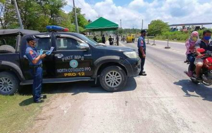 <p><strong>STRICT INSPECTION.</strong> Members of the Pikit municipal police in North Cotabato put up additional checkpoints along one of the strategic sections in town following the murder of a village councilman on Thursday (Aug. 27, 2020). Initial investigation revealed the incident could have been triggered by a feud by the councilman’s family with another clan.<em> (Photo courtesy of Pikit MPS)</em></p>
