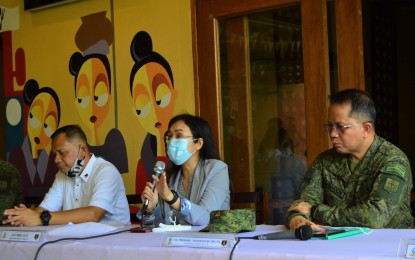 <p><strong>CHARGES VS. NPA.</strong> Northern Mindanao regional prosecutor Merlyn Uy (middle) answers queries from reporters during a press conference following the filing of cases against members of the communist New People’s Army in Bukidnon at a local court in Cagayan de Oro City on Wednesday (Sept. 2, 2020). The complainants and their families filed three cases against 22 suspects for alleged atrocities, including killing and destroying properties. <em>(PNA photo by Jigger J. Jerusalem)</em></p>