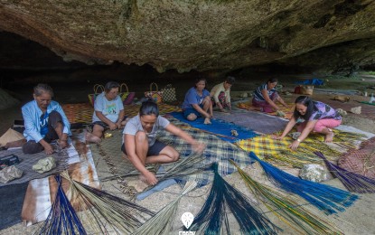 <p> </p>
<p><strong>MAT WEAVING.</strong> Women of Basey, Samar weaving mats inside the Saob Cave in this July 27, 2020 photo. A lawmaker in Samar province is pushing for the passage of the law developing the mat weaving industry and recognizes the town in Samar as the country’s banig (woven mat) capital. <em>(Photo courtesy of Spark Samar)​</em></p>
<p> </p>