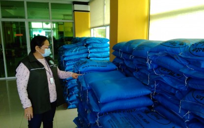 <p><strong>CLOUD SEEDING</strong>. Engineer Rosalinda Bote, department manager of the National Irrigation Administration-Upper Pampanga River Integrated Irrigation System, checks the bags of salt for cloud seeding over Pantabangan Dam. As of Sept. 12, 2020, the water level of Pantabangan Dam was at 182 meters above sea level (masl), way below the 201 masl by the start of September in 2019, and the 210 masl by end-October target. <em>(Contributed Photo)</em></p>
<p> </p>