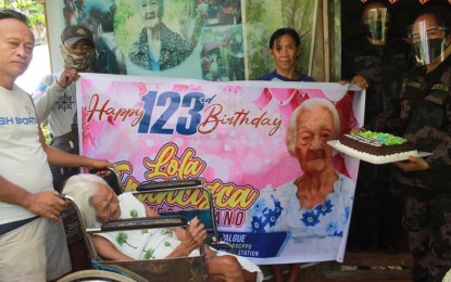 <p><strong>BIRTHDAY CHEERS.</strong> Personnel of Kabankalan City Police Station in Negros Occidental led by Lt. Col. Mary Rose Pico (right) greeted Francisca Montes-Susano, who turned 123 years old on Sept. 11, 2020 at her residence in Barangay Oringao. The super-centenarian is considered as the oldest living Filipino, and could also be the world’s oldest once her birth records are verified. <em>(Photo courtesy of Kabankalan City Police Station)</em></p>
<p> </p>