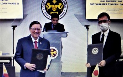 <p><strong>EMERGENCY BUDGET</strong>. DOF Secretary Carlos Dominguez (left) and JICA Senior Representative to the Philippines Eigo Azukisawa (right) show the signed documents for the Post Disaster Stand-by Loan (Phase 2) Tuesday (Sept. 15, 2020). The 50-billion yen (PHP23.3 billion) loan facility can be accessed when the Philippine government needs budgetary support to address the impact of a crisis or a disaster. <em>(Photo by Joanne Villanueva)</em></p>
<p> </p>