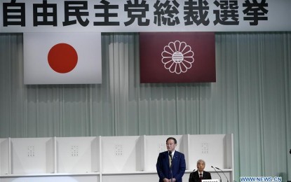 <p>Japanese Chief Cabinet Secretary Yoshihide Suga (left) makes a speech after his election as the new president of Japan's ruling Liberal Democratic Party (LDP) during the LDP's leadership election in Tokyo, Japan on Sept. 14, 2020. Yoshihide Suga was elected as the new president of the ruling LDP on Monday at a joint plenary meeting of party members from both houses of the Diet and delegates from local chapters.<em> (Eugene Hoshiko/Pool via Xinhua)</em></p>