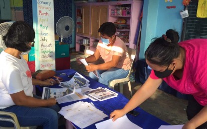 <p>Teachers in Sabang Central Elementary School in Borongan City, Eastern Samar arrange modules as the country shifts to distance learning.</p>