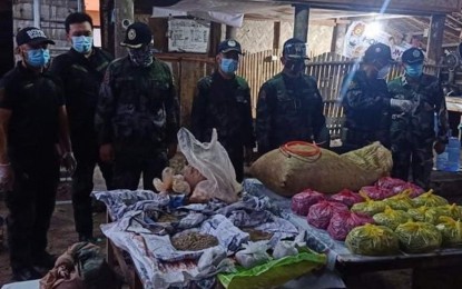 <p><strong>EXPLOSIVES SEIZED.</strong> Police operatives and the PHP3.5 million worth of explosives and raw materials recovered in Burabod village, San Antonio, Northern Samar on Sunday (Sept. 20, 2020). The police said the explosives are intended for illegal fishing. <em>(Photo courtesy of Northern Samar police)</em></p>