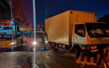 <p><strong>EDSA COLLISION.</strong> A van struck the rear of a light truck after it collided with several barriers along Edsa on Tuesday morning. The Metropolitan Manila Development Authority said the incident was caused by overspeeding, leaving one person injured.<em> (Photo courtesy of MMDA)</em></p>