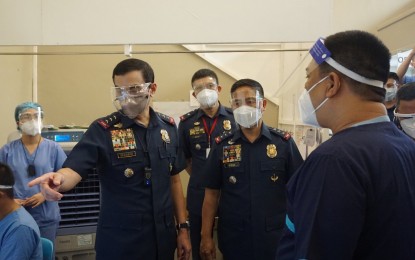 <p><strong>VISIT TO QUARANTINE FACILITIES.</strong> PNP Deputy Chief for Administration, Lt. Gen. Guillermo Eleazar (left) and Deputy Chief for Operations, Lt. Gen. Cesar Hawthorne Binag (center) meet with police officers during their visit to a quarantine facility managed by the PNP on Thursday (Sept. 24, 2020). Eleazar and Binag met with PNP personnel manning the quarantine facilities to listen to their concerns and other needs. <em>(Photo courtesy of JTF Covid Shield)</em></p>