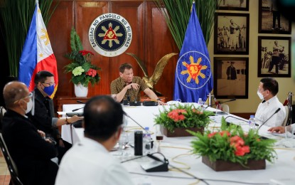 <p><strong>APPROVED.</strong> President Rodrigo Roa Duterte holds a meeting with the Inter-Agency Task Force on the Emerging Infectious Diseases (IATF-EID) members at the Malago Clubhouse in Malacañang on Sept. 28, 2020. A Pulse Asia survey released on Thursday (Oct. 10, 2020) said 84 percent of Filipinos approve of the Duterte administration’s response against the coronavirus disease 2019 pandemic. <em>(Presidential photo by Richard Madelo)</em></p>