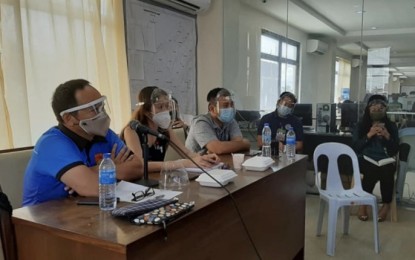 <p><strong>LOW POSITIVITY RATE.</strong> Councilor Joel Garganera (left) is shown in this undated photo meeting with stakeholders at the Emergency Operations Center (EOC) in Cebu City. Garganera on Wednesday (Sept. 30, 2020) said the capital city logged 0.7-percent positivity rate based on Tuesday data, with only four new Covid-19 cases out of 575 test results.<em> (Photo courtesy of Councilor Joel Garganera)</em></p>