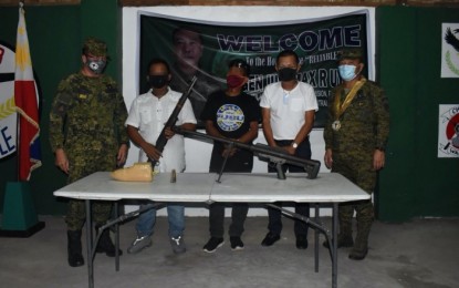 <p><strong>SURRENDER.</strong> Two Bangsamoro Islamic Liberation Front combatants surrender to the Army’s 34th Infantry Battalion in Northern Kabuntalan, Maguindanao on Wednesday (Sept. 30, 2020). Northern Kabuntalan Mayor Ramil Dilangalen (2nd from right) and military officials joined the two BIFF surrenderers. <em>(Photo courtesy of 6ID)</em></p>
