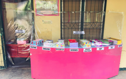 <p><strong>'NEW NORMAL' EDUCATION.</strong> Modules are readied for parents to pick up in front of one of the classrooms at the Upper Carment Elementary School, Cagayan de Oro City, as transparent plastic barriers are installed to prevent possible coronavirus disease infections. Both parents and teachers see the challenges under the new normal mode of education, although they remain optimistic that the new experience could lead to insights and better learning opportunities.<em> (Photo courtesy of Kristine Eblacas)</em></p>