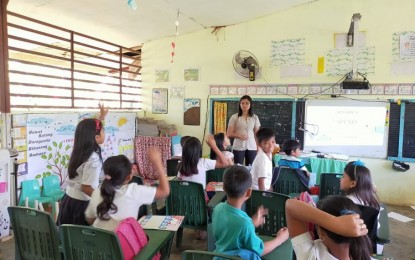 <p><strong>RISING ABOVE CHALLENGES</strong>. Christene Dayap-Villanueva is shown in an undated photo together with her former students at the Mabini Elementary School in a remote village in Daraga town, Albay province. She advised learners to not let the health crisis stop them from realizing their dreams. <em>(Photo courtesy of Christene Villanueva)</em></p>
