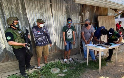 <p><strong>BUY-BUST.</strong> Operatives of the Philippine Drug Enforcement Agency arrest Arnold Ferrer, 47, a target-listed drug personality on Thursday (Oct. 1, 2020) in a buy-bust operation in Ipil, Zamboanga Sibugay. Ferrer is one of the three arrested drug suspects in Region 9 on the same day, including an alleged big-time drug personality who was killed in a shootout with law enforcement authorities. <em>(Photo courtesy of PDEA-9)</em></p>
