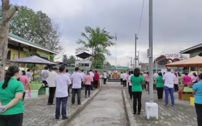 <p><strong>FLAG RAISING.</strong> Officials and personnel of the Department of Education-Region 12 and the Koronadal City division join the first flag-raising ceremony for the school year 2020-2021 of the Koronadal National Comprehensive High School in Koronadal City in line with the formal opening of classes on Monday (Oct. 5, 2020). Officials assure that proper health protocols will be followed by teachers and other school personnel as they perform their duties amid the coronavirus disease 2019 or Covid-19 pandemic. <em>(PNA GenSan photo)</em></p>