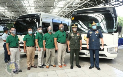 <p><strong>NEW COASTER MINIBUSES.</strong> AFP chief-of-staff Lt. Gen. Gilbert Gapay (2nd from right) receives the Coaster minibuses donated by the Armed Forces and Police Mutual Benefit Association, Inc. (AFPMBAI), led by its president and CEO retired Maj. Gen. Rizaldo B. Limoso (3rd from right) in a ceremony in Camp Aguinaldo, Quezon City on Monday (Oct. 5, 2020). The Coaster buses will be given to the Western Command, Eastern Mindanao Command, Western Mindanao Command, and the Philippine Military Academy. <em>(Photo courtesy of AFP Public Affairs Office)</em></p>