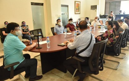 <p><strong>REOPENING OF CINEMAS</strong>. Cebu City Mayor Edgardo Labella (left) meets on Wednesday (Oct. 7, 2020) with administrators of malls in the city to discuss their request to allow movie theaters to operate again. He said mall managers must first submit their position papers to assure that they will implement the mandated health and safety protocols to movie goers.<em> (Photo courtesy of Cebu City PIO)</em></p>